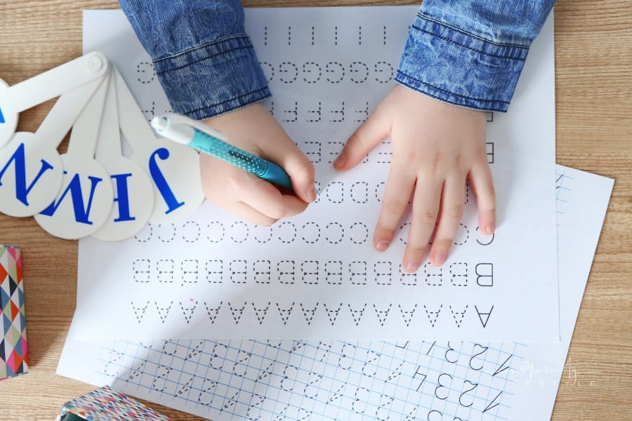 Child Learning How to Write Letters by Tracing Worksheets